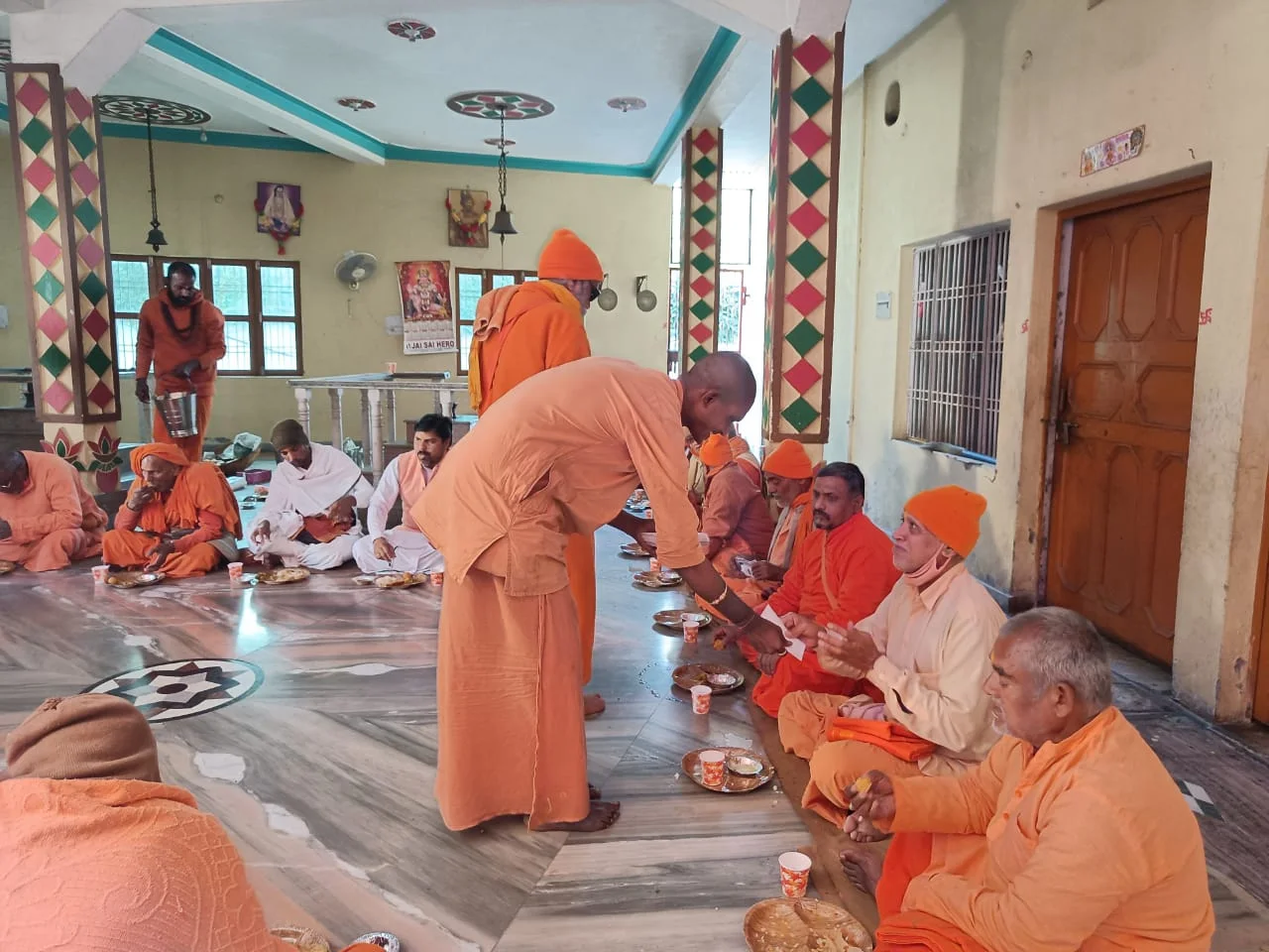 Serving prasadam